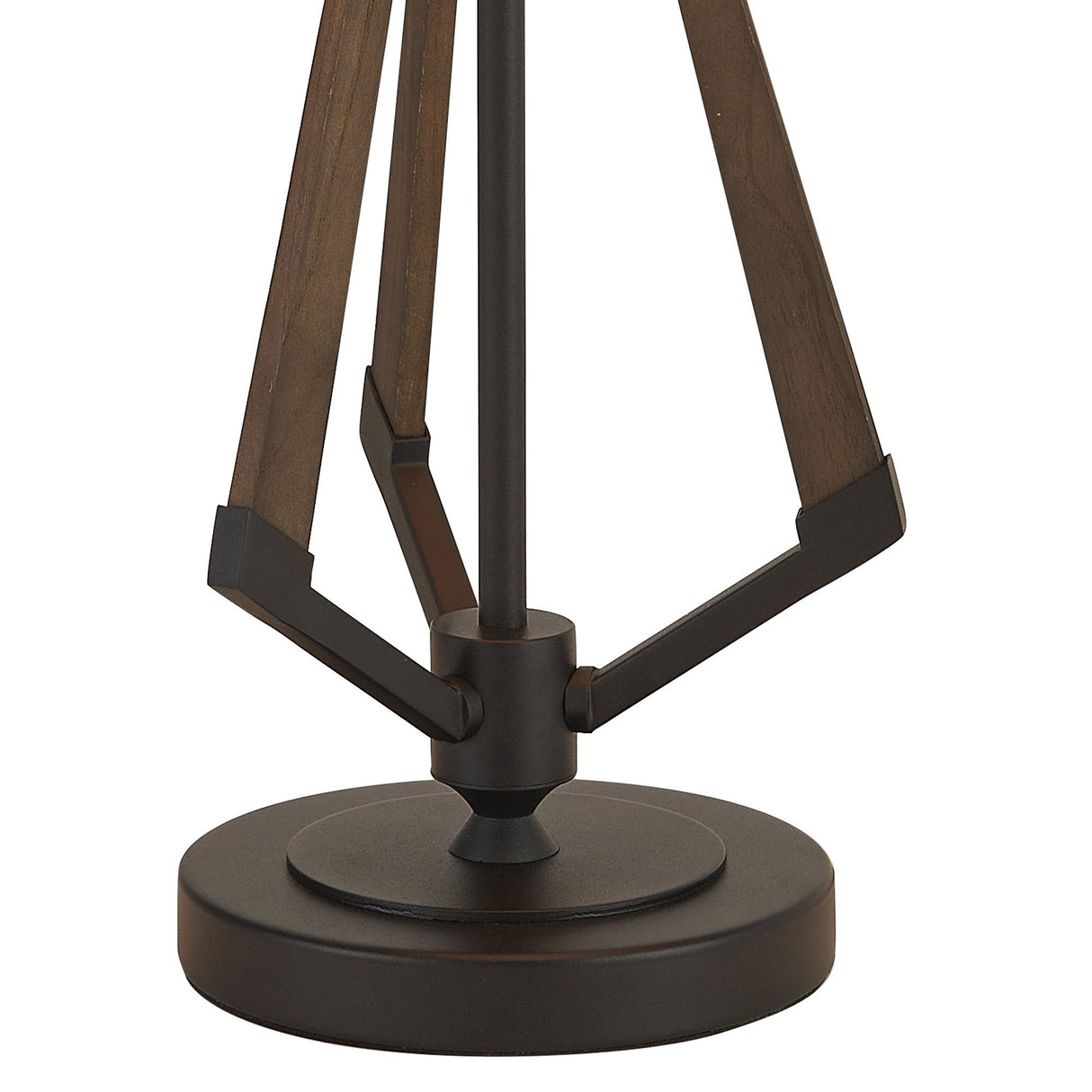 A close-up of the Hilton 1 Light Wood Table Lamp shows its round, dark metal base with angled wooden supports in black and grey, joined by metal brackets, topped with a taupe/halo gold shade.