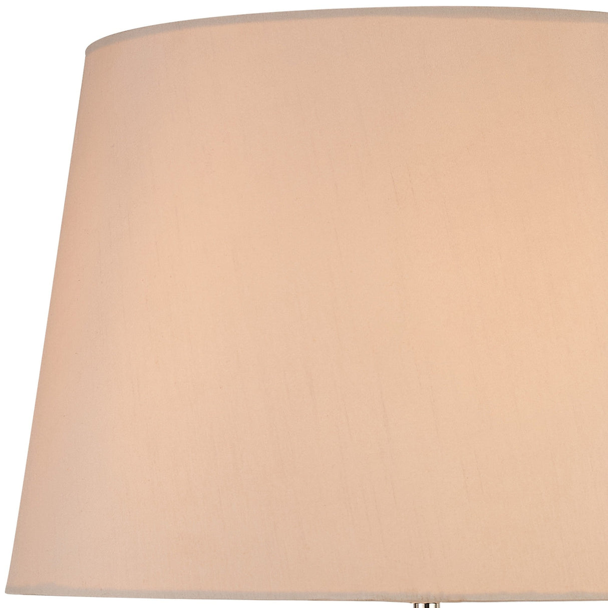 Close-up of the Hilton 1 Light Wood Table Lamp in nickel and taupe, featuring a nude beige shade. Soft, warm lighting highlights the top of the elegant lampshade against a white background.