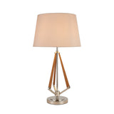The Hilton 1 Light Wood Table Lamp features a nickel and taupe finish, nude beige shade, metallic base, and wooden geometric accents for a modern look.