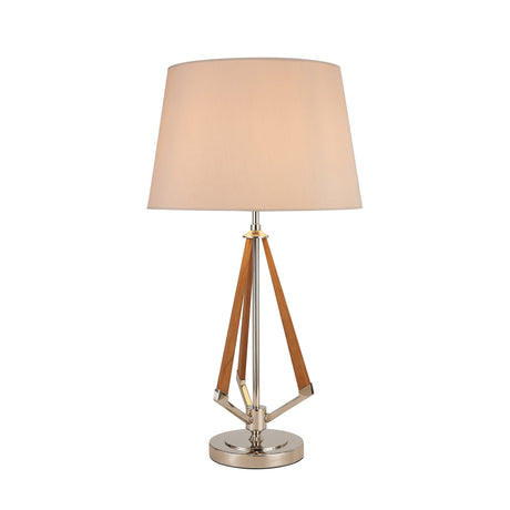 The Hilton 1 Light Wood Table Lamp features a nickel and taupe finish, nude beige shade, metallic base, and wooden geometric accents for a modern look.