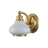 The Ainsley 1 Light Wall Light in brushed brass features an opal glass shade attached to a round base plate with a curved arm, incorporating an energy-efficient LED lamp for optimal lighting.