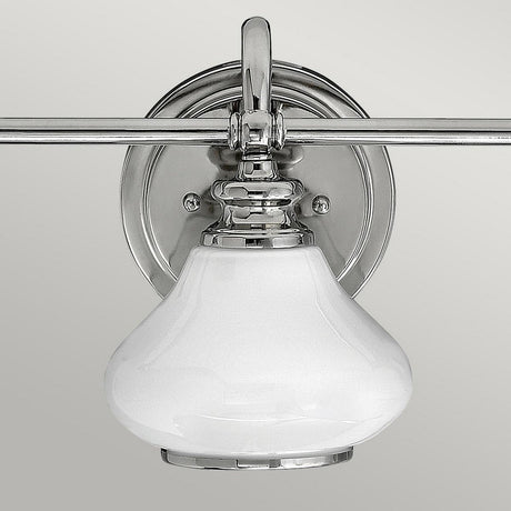 The Ainsley 3 Light Wall Light in polished chrome is an elegant and modern wall-mounted light fixture featuring opal glass shades and energy-efficient LED lamps.