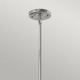 Close-up of the Amelia 1 Light Medium Pendant in chrome, showcasing its metallic finish with a round base plate and a vertical rod extending downward, set against a light gray background. This modern lighting fixture embodies both style and sophistication.