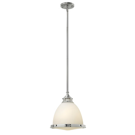 The Amelia 1 Light Medium Pendant - Chrome showcases a contemporary lighting design with its polished silver rod and opal glass dome-shaped shade. This pendant light exudes elegance and sophistication, perfectly complementing modern interiors.
