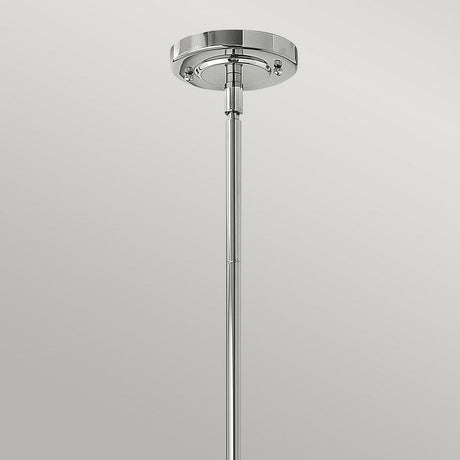 The Amelia 1 Light Mini Pendant - Chrome is a sleek metallic lighting fixture showcasing an opal glass dome, with a round base and a long, slender rod, set against a plain, light background.