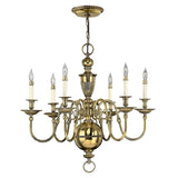 Gorgeous burnished brass chandelier showcasing eight arms, each adorned with a candle-like light. This design highlights intricate detailing and a gleaming finish, akin to the Cambridge 6 Light Chandelier - Burnished Brass, elegantly hanging via a chain and ceiling mount.