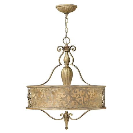 The Carabel 3 Light Chandelier - Brushed Champagne showcases timeless elegance through its vintage-style design and intricate scrollwork on both the circular frame and ornate central column. Suspended by a chain, it provides an elegant lighting solution with a traditional charm.