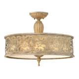 The Carabel 3 Light Large Semi Flush in a brushed champagne finish features an ornate, patterned metal exterior with intricate scrollwork. It emits a warm glow through its translucent diffuser at the bottom, making it perfect for your semi flush lighting needs.