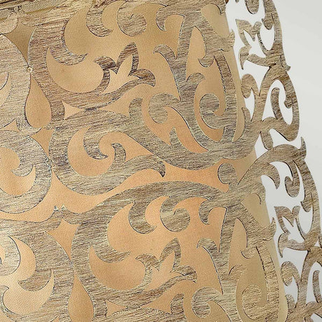 Close-up of an intricate decorative pattern featuring swirling, metallic gold designs on a warm beige background, reminiscent of the Carabel 2 Light Wall Light's brushed champagne finish. The ornate scrollwork boasts a textured finish akin to pierced metalwork artistry.