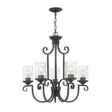 The Casa 5 Light Chandelier in black showcases a sophisticated wrought iron frame with six gracefully curved arms, each holding a bulb nestled within seedy glass shades. This elegant fixture is suspended by a sturdy chain, making it a sophisticated addition to any room.