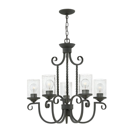 The Casa 5 Light Chandelier in black showcases a sophisticated wrought iron frame with six gracefully curved arms, each holding a bulb nestled within seedy glass shades. This elegant fixture is suspended by a sturdy chain, making it a sophisticated addition to any room.