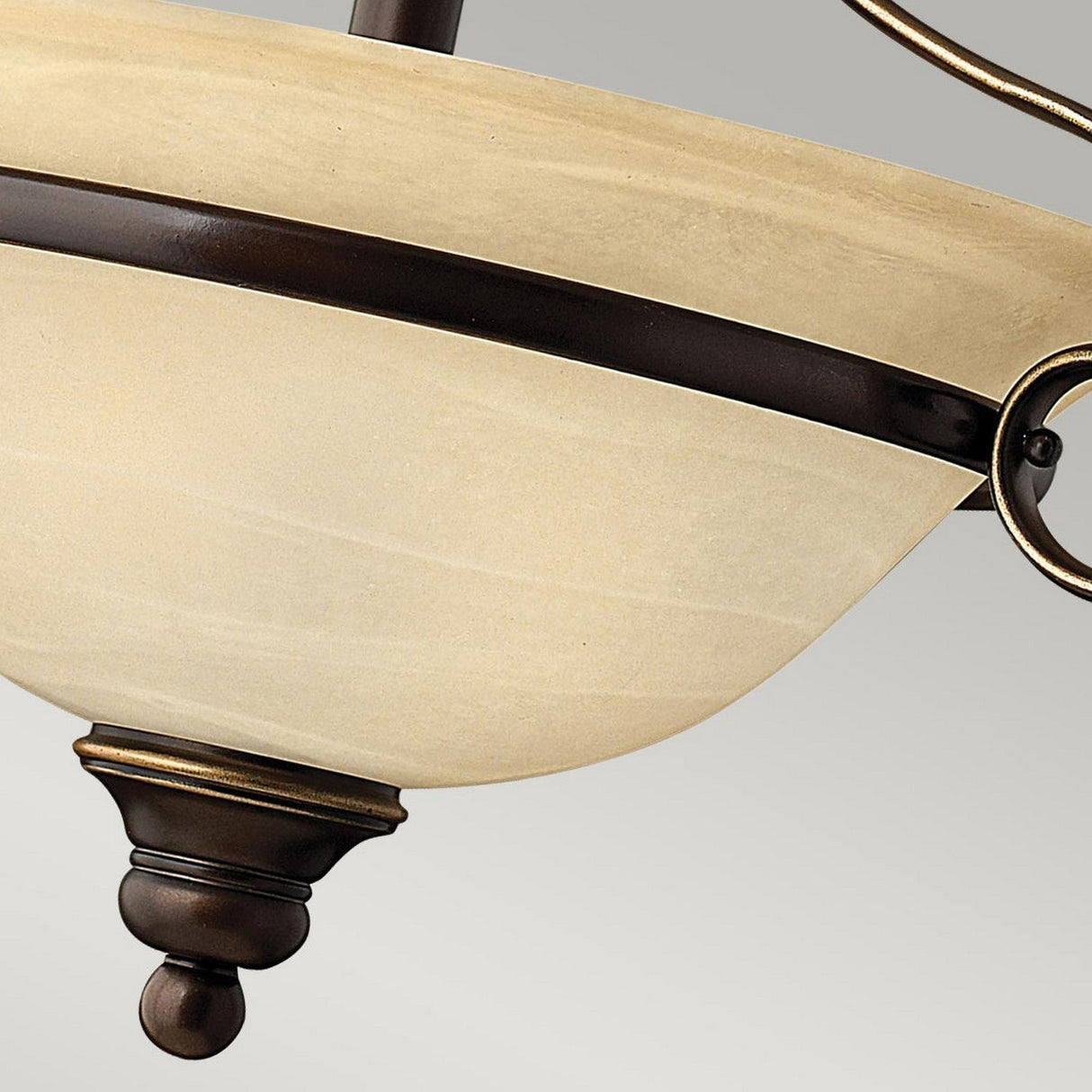A close-up of the Cello 2 Light Semi Flush fixture in beige, featuring a bowl-shaped design with an antique bronze metal rim reminiscent of vintage faux alabaster glass. The traditional design highlights elegant curves and a smooth finish, perfectly suspended against a neutral background.