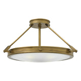 The Collier 4 Light Large Semi Flush in Heritage Brass exhibits a contemporary design with a round, frosted glass diffuser. It is supported by three angled rods connected to a circular mount, embodying the sleek and elegant style characteristic of the collection.