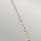 A minimalist image showcases the Congress 1 Light Clear Glass Pendant in a brushed caramel finish, positioned diagonally against a gray background. The pendant's smooth texture and delicate shadows offer an elegant contrast.