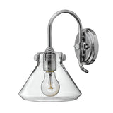 The Congress 1 Light Clear Glass Wall Light in Chrome boasts a modern design with a funnel-shaped clear glass shade. Its exposed Edison-style bulb offers a vintage touch to its industrial and contemporary aesthetic.