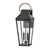 The Dawson 1 Light Outdoor Large Wall Lantern in Black Oxide features a black frame, rectangular glass, two candle-style bulbs, and a gold curved handle—ideal for stylish exterior lighting.