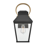 The Dawson 1 Light Outdoor Medium Wall Lantern in Black Oxide has clear glass panels, a single exposed bulb, and a gold-tone handle—ideal for elegant patio lighting.