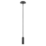 The Dax LED Mini Pendant - Black features a sleek, cylindrical shade and hangs from an extended cord. Set against a plain white backdrop, it highlights its modern and minimalistic design while delivering energy-efficient lighting.