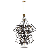 The Fulton 13 Light Large Chandelier in Bronze and Brass features a modern design with multiple geometric metal frames, forming a clustered arrangement that highlights exposed bulbs within each frame. The vintage industrial fixture artfully combines bronze and brass tones to achieve an elegant and contemporary appearance.