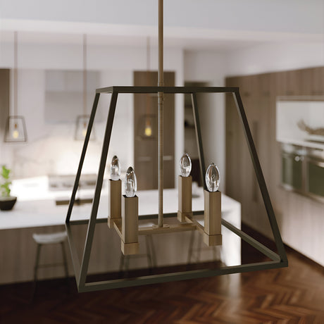 A contemporary kitchen featuring the Fulton 4 Light Pendant Chandelier in bronze and brass, which holds four bulbs. The background displays a kitchen island, bar stools, and pendant lights. Wooden cabinets enhance the elegant appearance of the herringbone flooring for a sleek look.