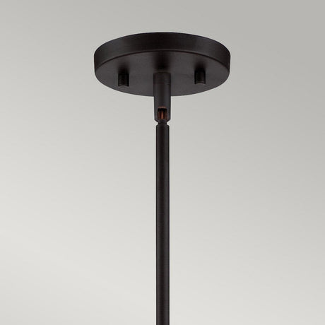 Close-up of the Gemma 3 Light Chandelier in vintage bronze, featuring a round base and single rod extending downwards for a contemporary style touch. The background is a plain off-white wall.