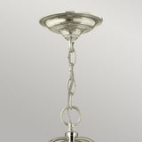 A close-up of the Gentry 6 Light Large Pendant - Polished Nickel shows its polished nickel chandelier chain connected to a ceiling mount. The chain features large, linked metal loops with a shiny, reflective finish set against a light gray background.