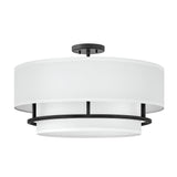 The Graham 4 Light Duo-Mount Pendant/Semi-Flush - Black showcases a modern circular design infused with classic charm. It comes with a white fabric shade and black metal accents, offering a sleek, contemporary appearance that enhances any interior. The Black Duo-Mount option provides versatile installation to match your style preferences.