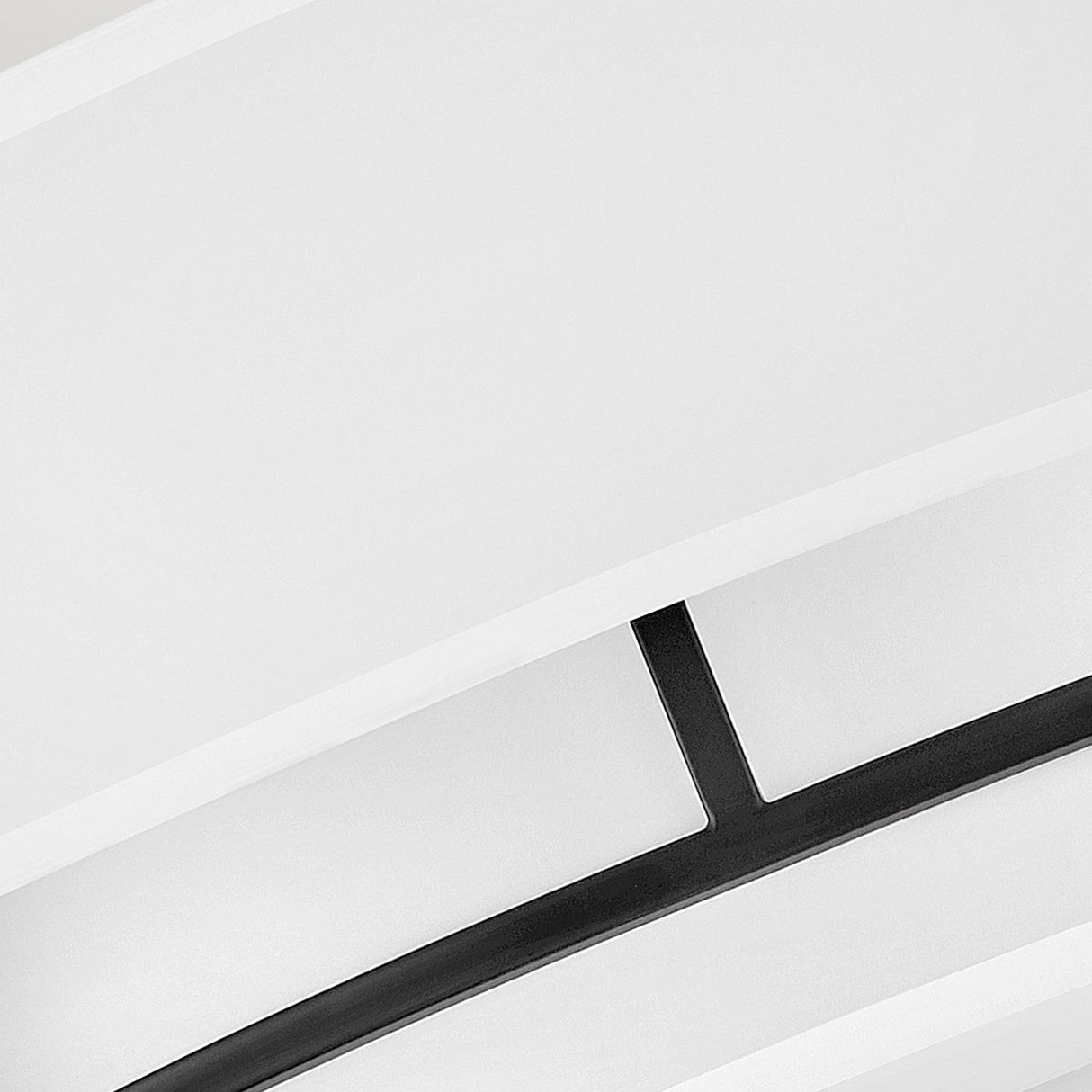 A close-up of the Graham 4 Light Duo-Mount Pendant/Semi-Flush - Black highlights its sleek design featuring black metal accents and layered curved panels. This modern ceiling light exudes classic charm with its minimalist and sophisticated appearance, making it a standout piece in any space.