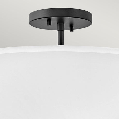 Close-up of the Graham 3 Light Duo-Mount Pendant/Semi-Flush in Black, showcasing a luminous faux parchment shade with a black welded frame, set against a neutral background.