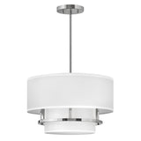 Introducing the Graham 3 Light Duo-Mount Pendant/Semi-Flush in polished nickel, featuring a sleek silver finish and a white drum-shaped shade. This modern light fixture boasts a layered design with a subtle candle-like appearance and is suspended from a straight rod connected to a circular ceiling mount.