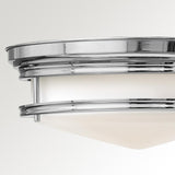 The Hadley 3 Light Flush - Chrome is a contemporary circular fixture featuring an etched opal glass shade, beautifully captured against a simple off-white backdrop.