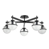 The Hollis 5 Light Semi Flush in black features a striking semi-flush design that embodies Mid-Century Modern Lighting with its five spherical, clear seeded glass shades. These shades are encircled by a sleek black band and arranged in a circular formation, supported by angular black metal arms for a modern aesthetic.