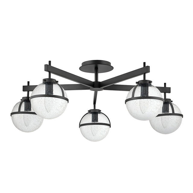 The Hollis 5 Light Semi Flush in black features a striking semi-flush design that embodies Mid-Century Modern Lighting with its five spherical, clear seeded glass shades. These shades are encircled by a sleek black band and arranged in a circular formation, supported by angular black metal arms for a modern aesthetic.