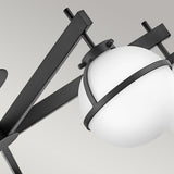 The Hollis 5 Light Semi Flush is a contemporary fixture featuring an angular black metal frame and opal etched glass globes that elegantly diffuse light. Its sleek design combines modern and industrial aesthetics while showcasing a sophisticated black finish.