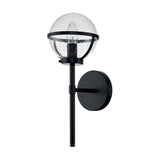 The Hollis 1 Light Wall Light features a sleek black metal frame and a modern Art Deco design, complete with a round, clear glass globe. Its single vertical support and circular mount complement the small bubbles within the globe, making it an ideal choice for stylish bathroom lighting.