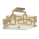 The Lanza 3 Light Semi Flush - Brushed Bronze features a sleek geometric design with intertwined metal rectangles in a brushed bronze finish set against a beige backdrop. Its base is enhanced by a frosted glass panel, bringing sophisticated elegance to any room.