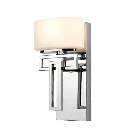 The Lanza 1 Light Wall Light in polished chrome boasts a rectangular metal base and an opaque white glass shade, highlighting its geometric design and contemporary craftsmanship for a sleek, modern appearance.
