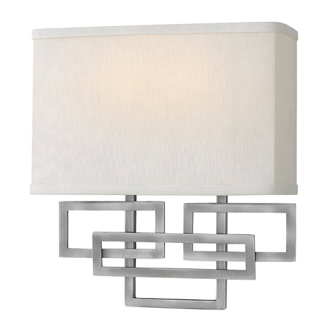 The Lanza 2 Light Wall Light - Antique Nickel seamlessly combines modern and traditional elements, featuring a rectangular white fabric shade and an antique nickel geometric metal frame with overlapping shapes that offer both a contemporary and timeless appeal.