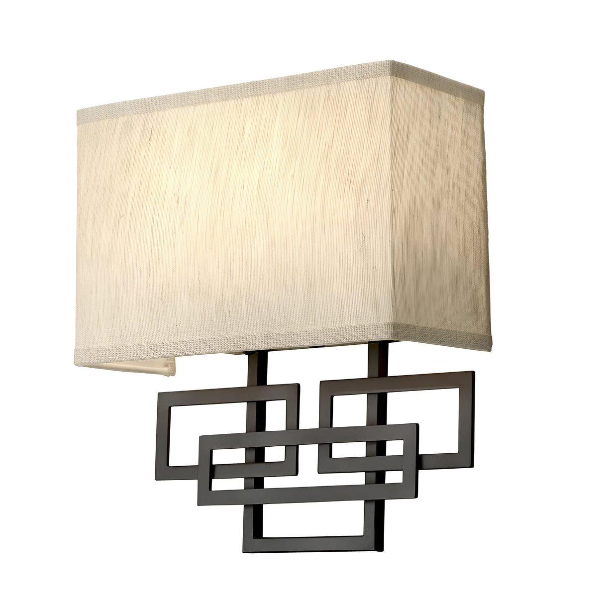 The Lanza 2 Light Wall Light in oil-rubbed bronze features a rectangular beige lampshade paired with a geometric black metal support of overlapping rectangles, infusing rustic elegance into any room. Its clean, contemporary design beautifully enhances interior decor with a stylish touch.