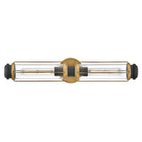 The Masthead 2 Light Wall Light showcases a contemporary design with two elongated Edison-style bulbs encased in clear glass shades. It features a Heritage Brass finish with black accents, along with a central mounting plate.