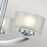Featuring the Meridian 3 Light Semi Flush - Polished Chrome, this close-up showcases a sleek light fixture with a translucent cylindrical shade and polished chrome accents, exuding a soft, warm glow. Its semi-flush design introduces a modern flair while promoting energy efficiency in the space.