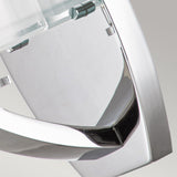 Close-up of the Meridian 1 Light Wall Light with its polished chrome finish and geometric design elements. The shiny metallic surface reflects light, accentuating its contemporary style and modern elegance against a minimalist gray background.