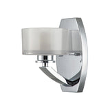 The Meridian 1 Light Wall Light - Polished Chrome exudes modern elegance with its polished chrome finish and frosted glass cylindrical shade, seamlessly mounting to the wall with a sleek rectangular base.