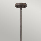 The Middlefield 1 Light Mini Pendant in Iron Rust, showcased against a light gray background, captures the essence of vintage charm lighting. Its textured finish and round ceiling mount enhance its timeless appeal.