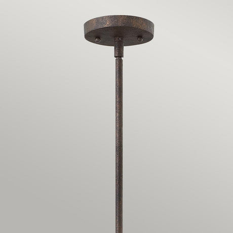 The Middlefield 1 Light Mini Pendant in Iron Rust, showcased against a light gray background, captures the essence of vintage charm lighting. Its textured finish and round ceiling mount enhance its timeless appeal.