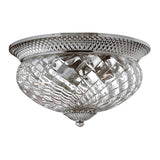 This decorative flush mount ceiling light, officially known as the Plantation 3 Light Large Flush - Polished Antique Nickel, features a diamond-patterned, pineapple-shaped clear optic glass shade and a polished antique nickel rim. Its classic design enhances any space with a vintage touch and elegant appeal.