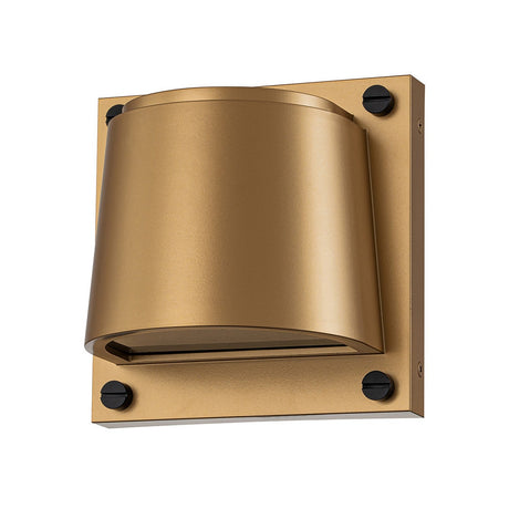 Explore the Scout Outdoor 1 Light Small Wall Light in Painted Heritage Brass, a contemporary wall fixture with a matte gold finish that evokes the charm of classic brass. It boasts a cylindrical shade and a square backplate accentuated with four visible black screws, ideal for enhancing the sophistication of your outdoor lighting arrangement.