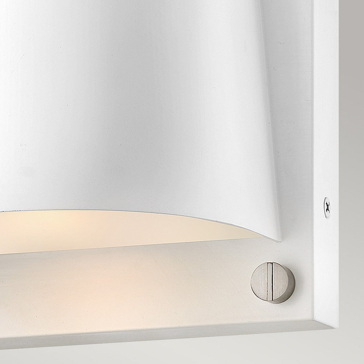 Close-up of the Scout Outdoor 1 Light Small Wall Light in a minimalist design, showcasing its IP44 rated satin white finish. This modern wall sconce features smooth curves with a simple metallic screw visible on the side, set against a neutral background. Ideal for both indoor and outdoor lighting needs.