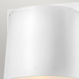 Close-up of the Scout Outdoor 1 Light Small Wall Light in a sleek curved design against a light gray background. This modern sconce, featuring an elegant satin white finish, emits a gentle warm light from below.