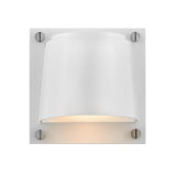 The Scout Outdoor 1 Light Small Wall Light in Satin White is a modern wall sconce with a minimalist design, featuring a satin white finish. It showcases a cylindrical shade mounted on a square backplate, secured by four metallic screws. This IP44 rated fixture is perfect for outdoor lighting and casts a soft, downward light to enhance any space.
